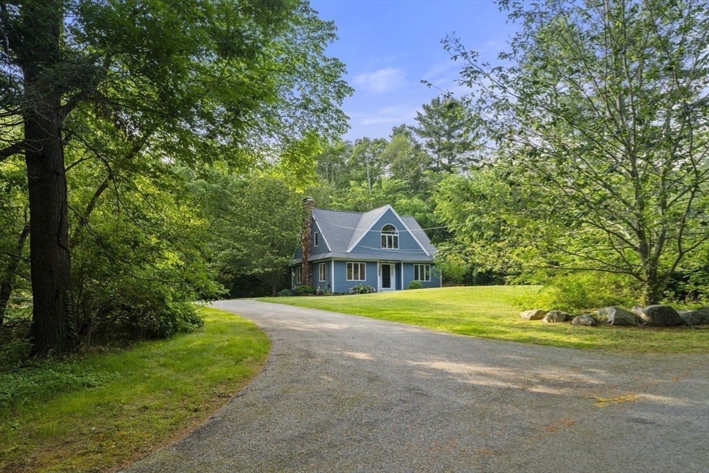 731 R Grove Street Norwell, MA 02061 - Photo 32 of 42 a front view of a house with a garden