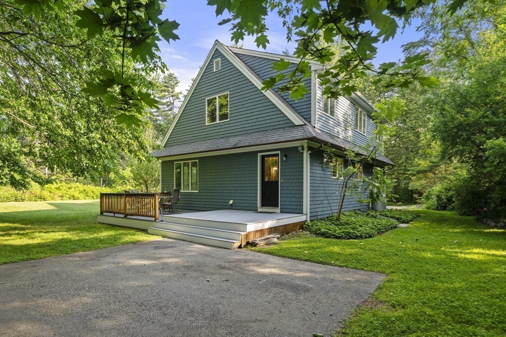 731 R Grove Street Norwell, MA 02061 - Photo 35 of 42 a front view of a house with a garden and yard