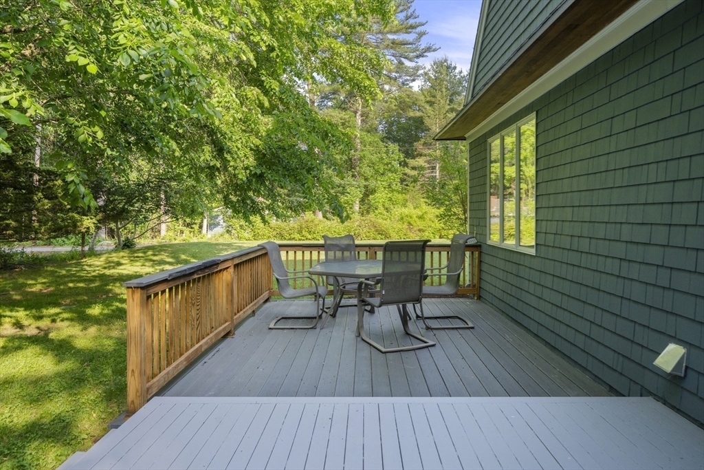 731 R Grove Street Norwell, MA 02061 - Photo 36 of 42 a balcony with wooden floor and outdoor seating