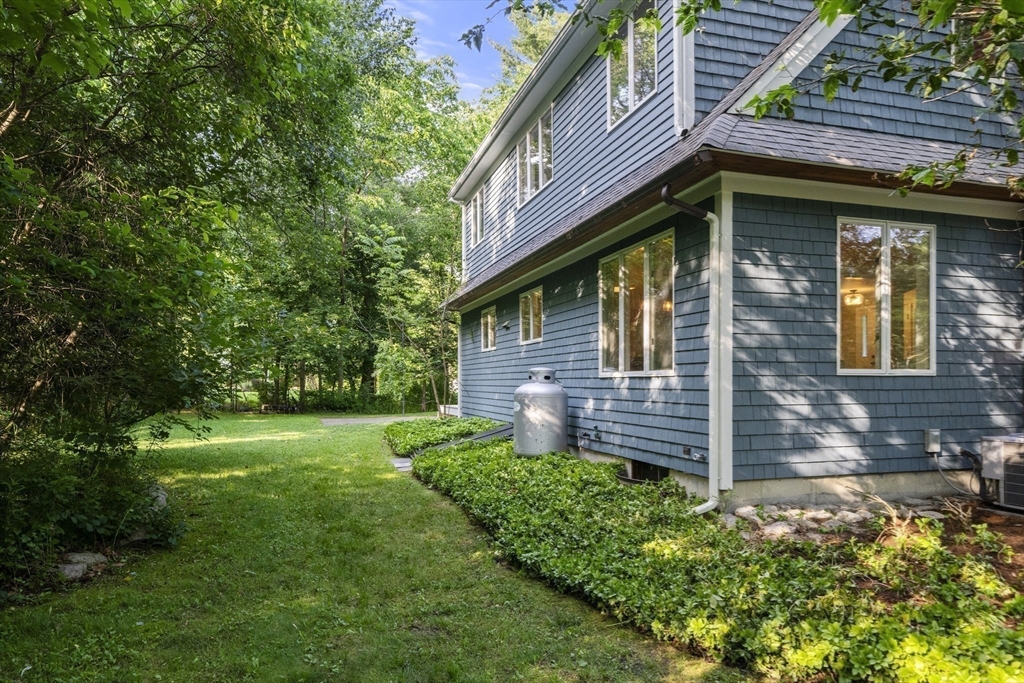 731 R Grove Street Norwell, MA 02061 - Photo 37 of 42 a view of a house with a yard
