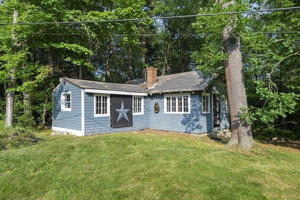 731 R Grove Street Norwell, MA 02061 - Photo 39 of 42 a view of a house with a yard and sitting area