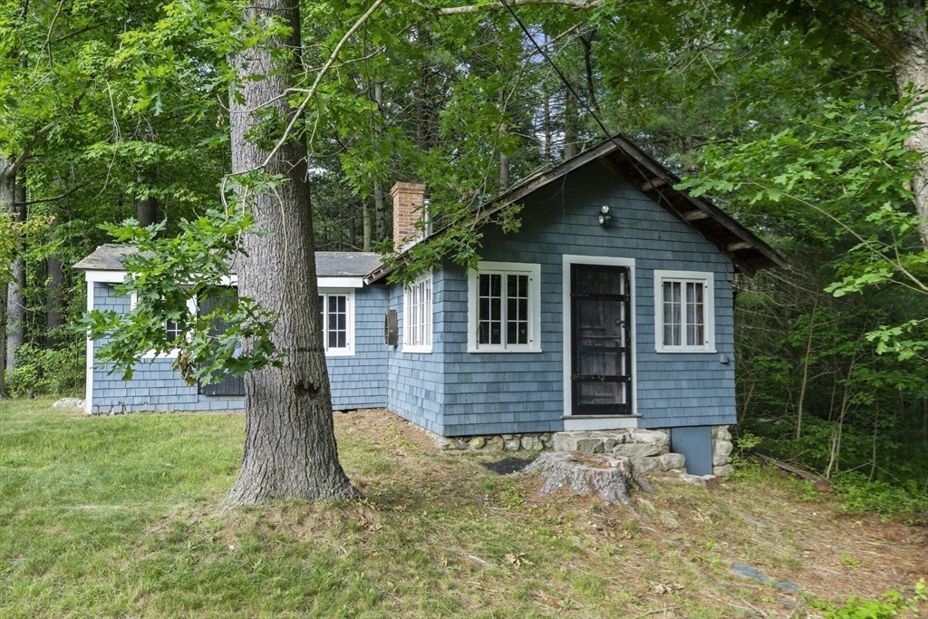 731 R Grove Street Norwell, MA 02061 - Photo 40 of 42 a front view of a house with garden