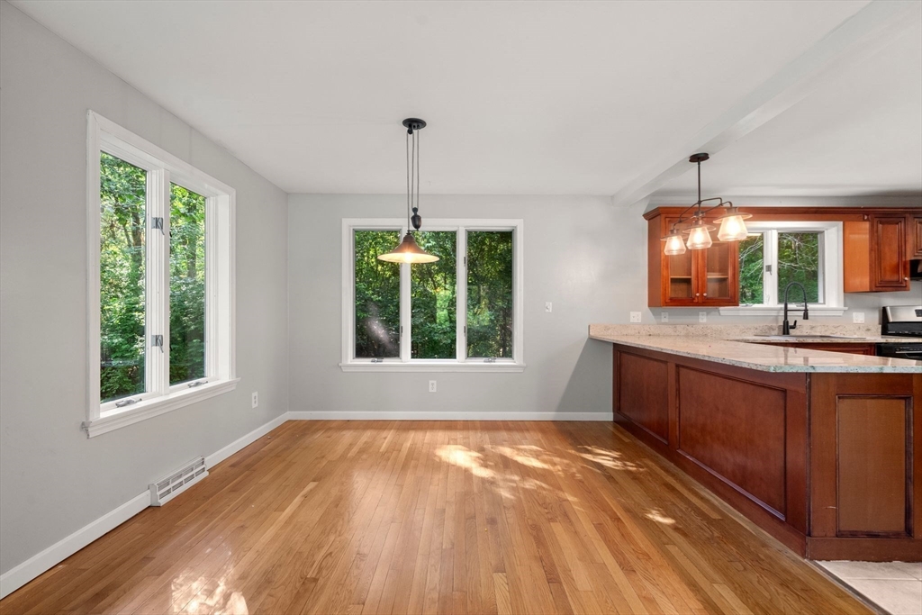 731 R Grove Street Norwell, MA 02061 - Photo 5 of 42 a view of kitchen with granite countertop window and sink