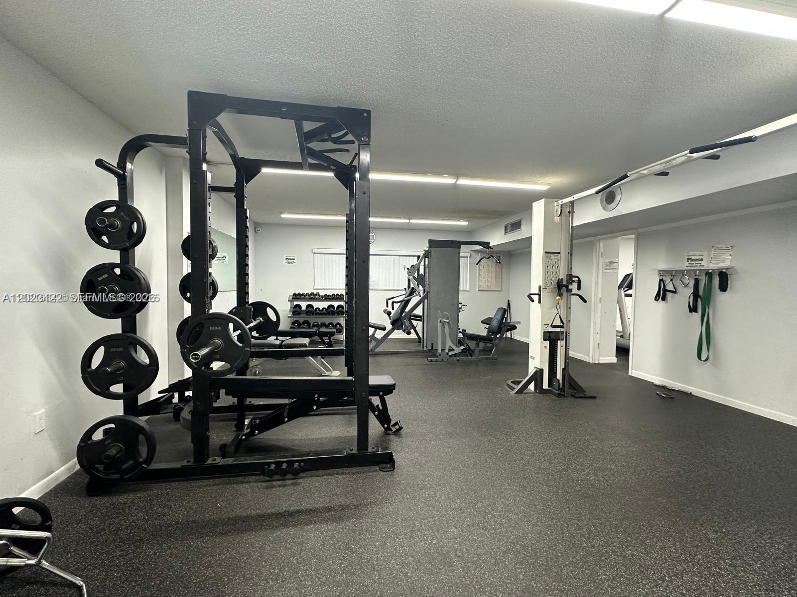605 Ives Dairy Road, Unit 3067 Miami, FL 33179 - Photo 5 of 28 a view of a room with gym equipment
