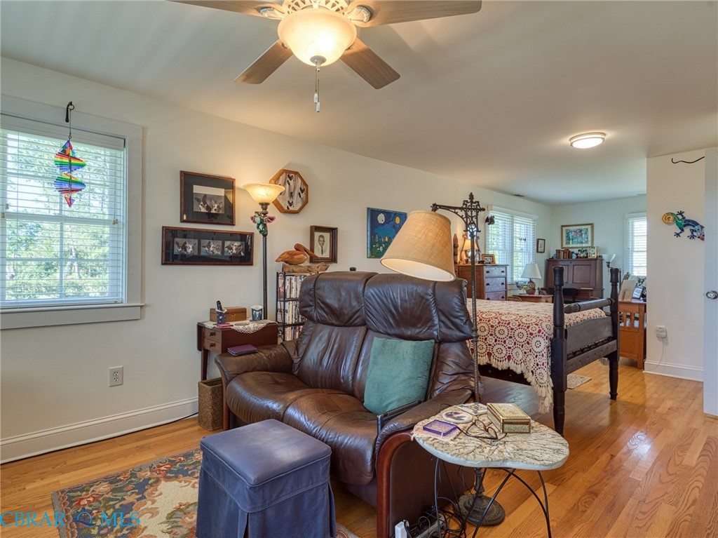 9078 Stump Point Road Hayes, VA 23072 - Photo 25 of 28 Bedroom featuring light wood-type flooring and a ceiling fan