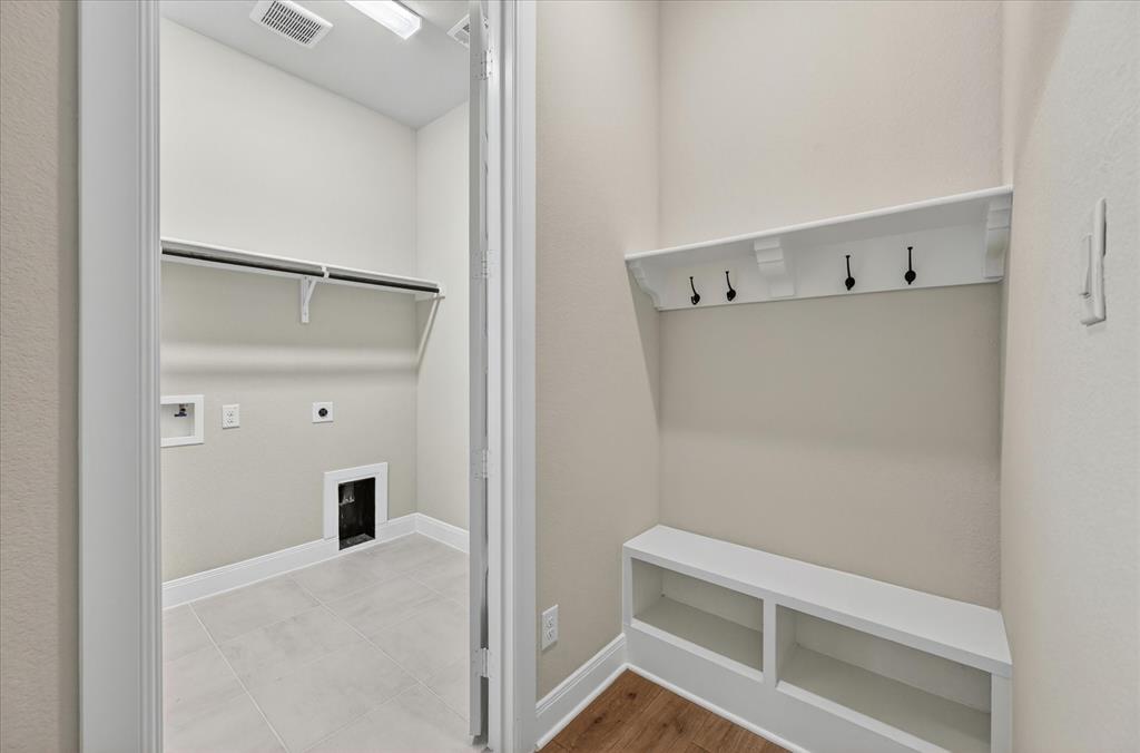 2237 Pika Road Northlake, TX 76247 - Photo 29 of 37 Dedicated laundry room featuring tile flooring, upper shelving, and connections for appliances