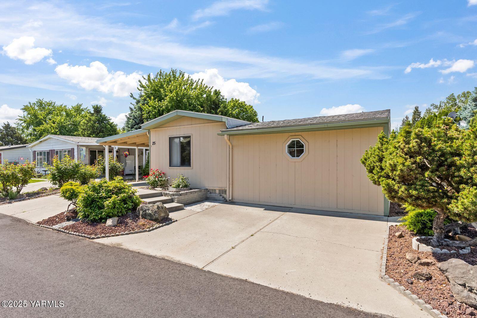 3701 Gun Club Road, Unit 25 Yakima, WA 98901 - Photo 3 of 30 a front view of a house with sitting area