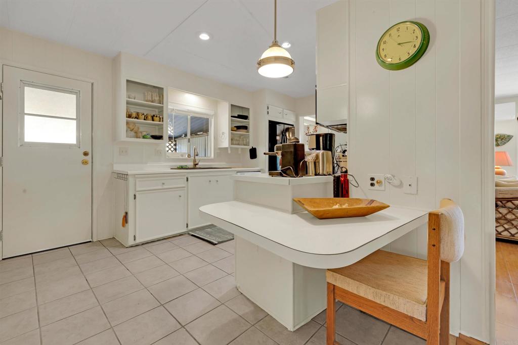 1010 Palm Canyon Drive, Unit 151 Borrego Springs, CA 92004 - Photo 14 of 31 a kitchen with a sink cabinets and wooden floor