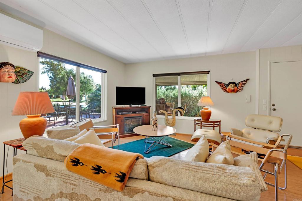 1010 Palm Canyon Drive, Unit 151 Borrego Springs, CA 92004 - Photo 9 of 31 a living room with furniture and a flat screen tv