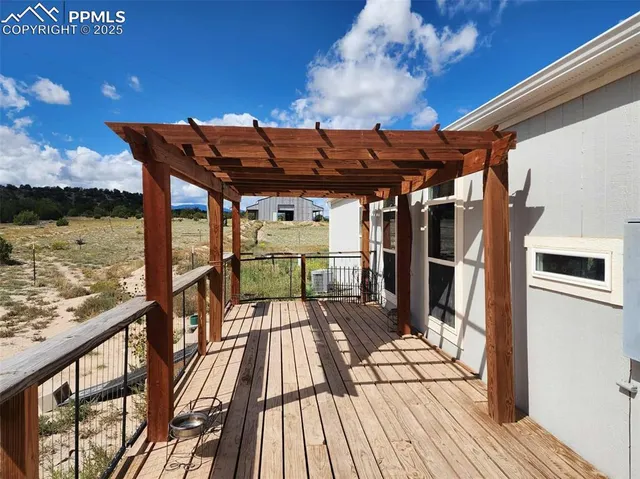 a view of a balcony with wooden floor