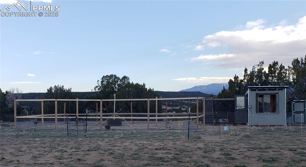 7490 Red Creek Springs Road Pueblo, CO 81005 - Photo 18 of 37 a view of a house with a yard