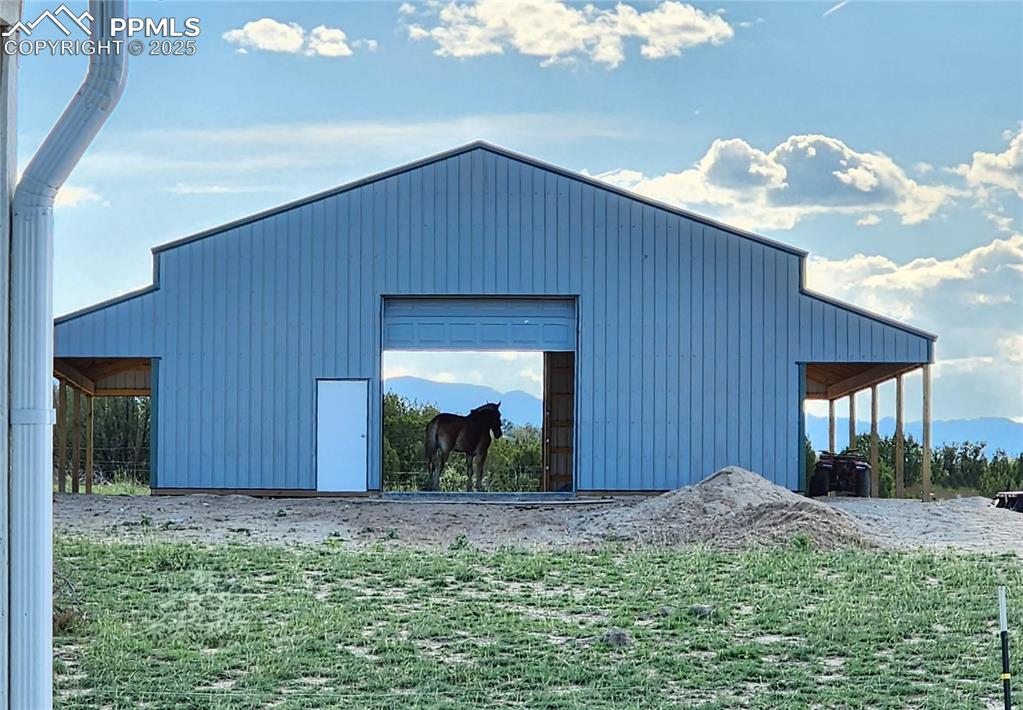 7490 Red Creek Springs Road Pueblo, CO 81005 - Photo 5 of 37 a view of a house with a yard