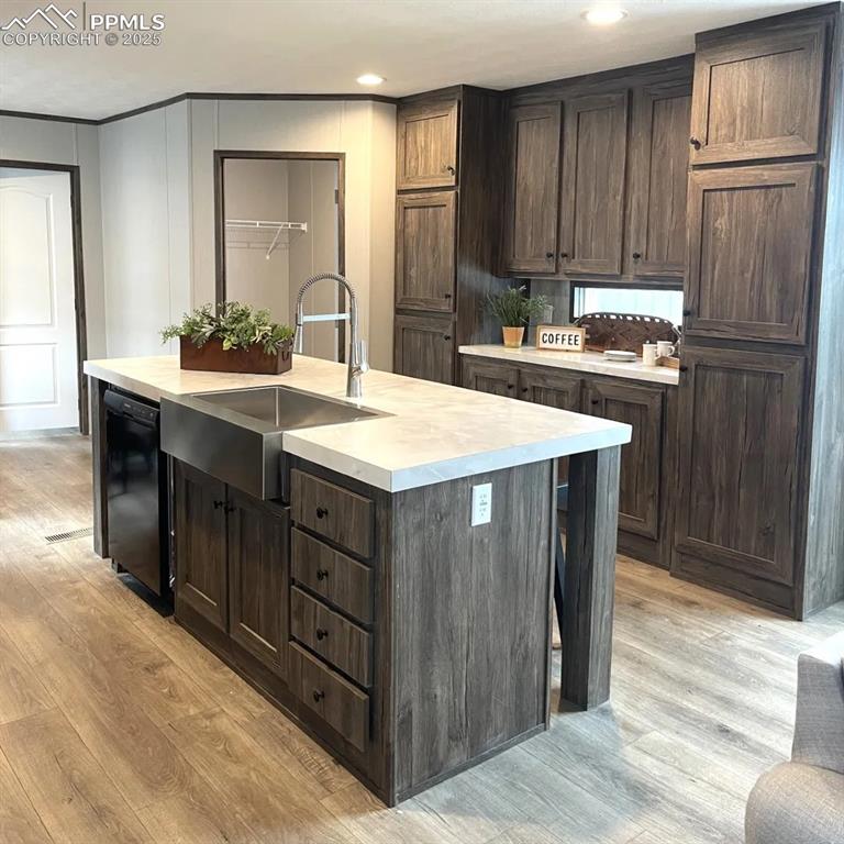 7490 Red Creek Springs Road Pueblo, CO 81005 - Photo 9 of 37 a kitchen with a sink refrigerator and cabinets