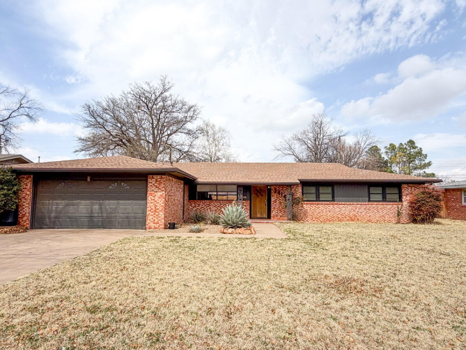 3414 57th Street Lubbock, TX 79413 - Photo 17 of 17 a front view of a house with a yard