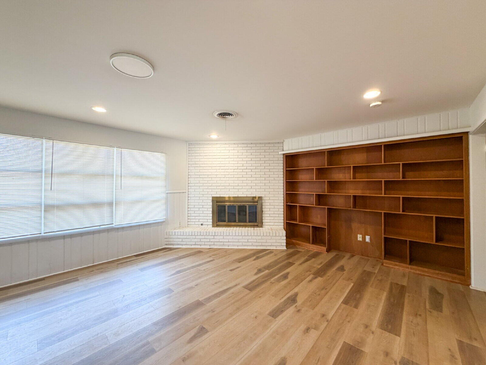 3414 57th Street Lubbock, TX 79413 - Photo 6 of 17 a view of an empty room with a closet and a window