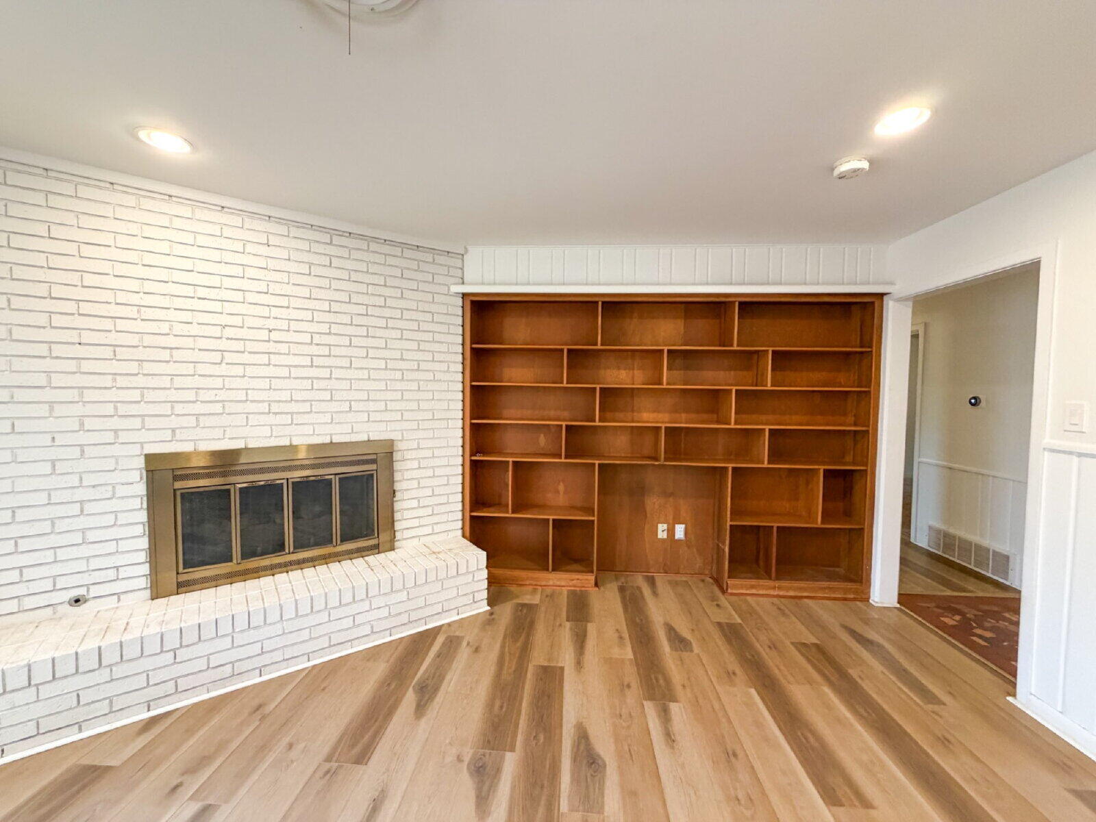 3414 57th Street Lubbock, TX 79413 - Photo 7 of 17 a living room with a furniture and a fireplace