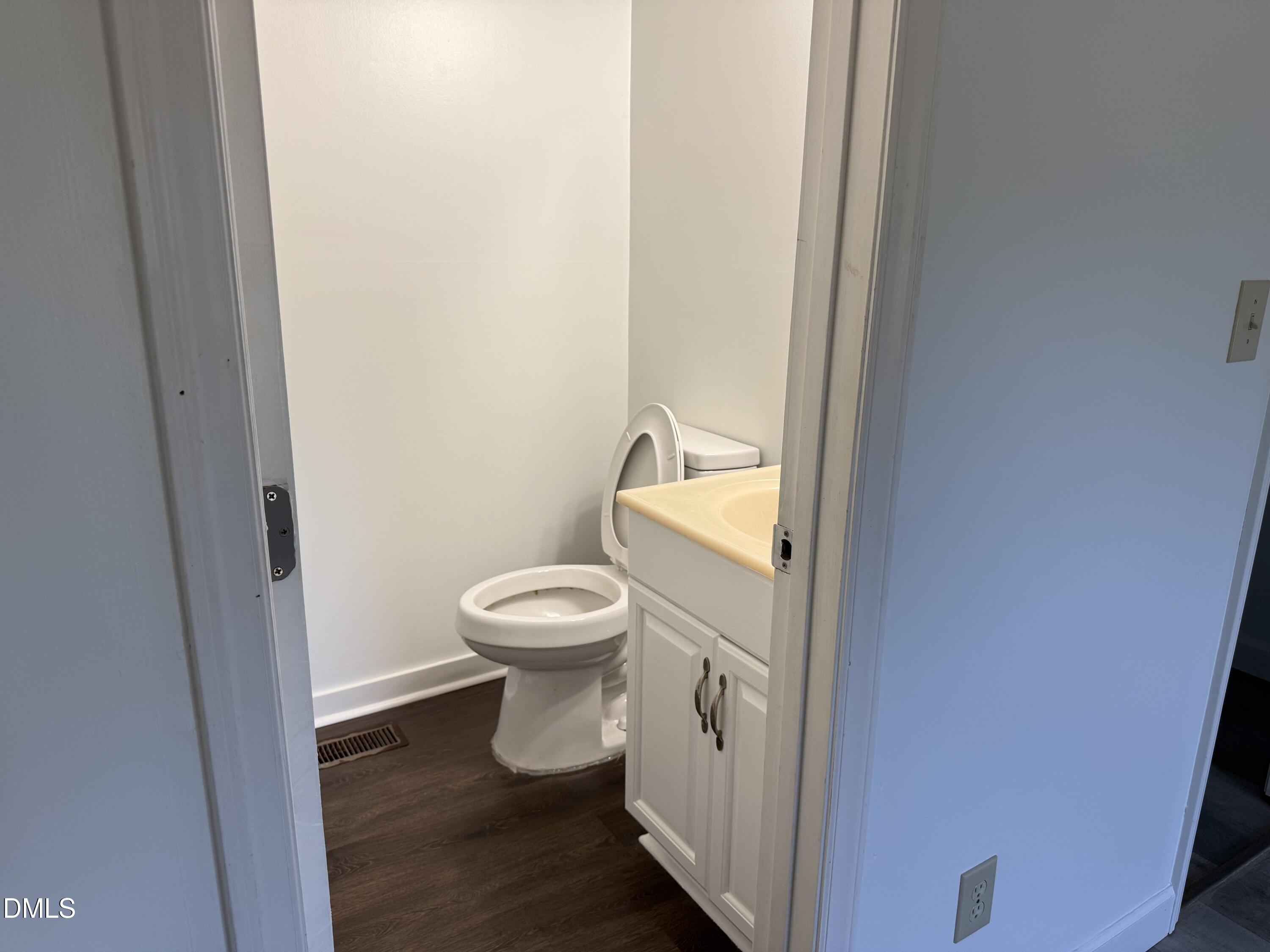 5509 Sandy Run Knightdale, NC 27545 - Photo 16 of 21 a white toilet sitting next to a sink