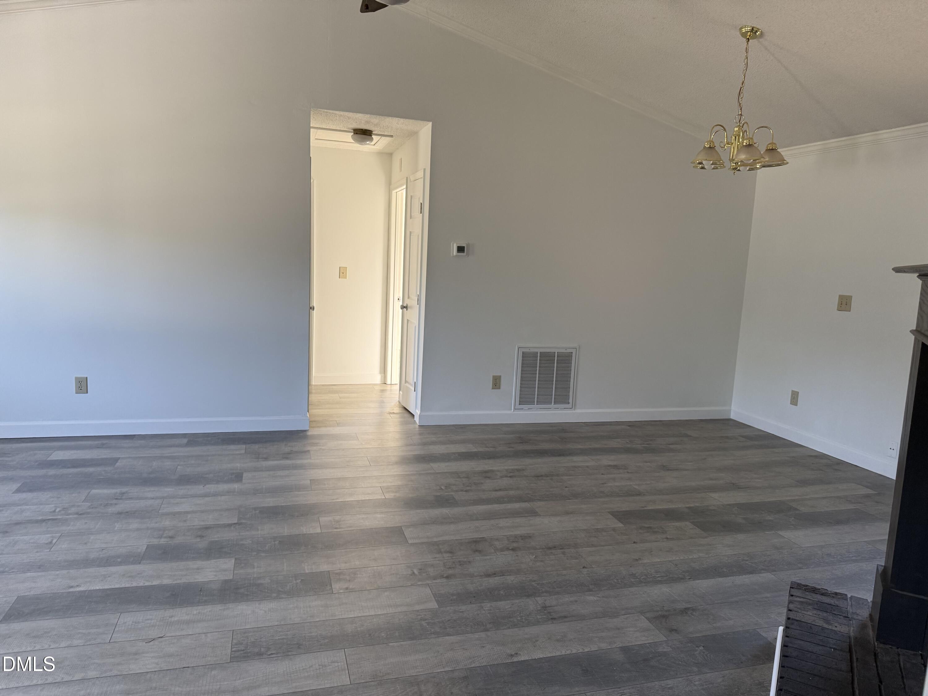 5509 Sandy Run Knightdale, NC 27545 - Photo 17 of 21 a view of an empty room with wooden floor and closet