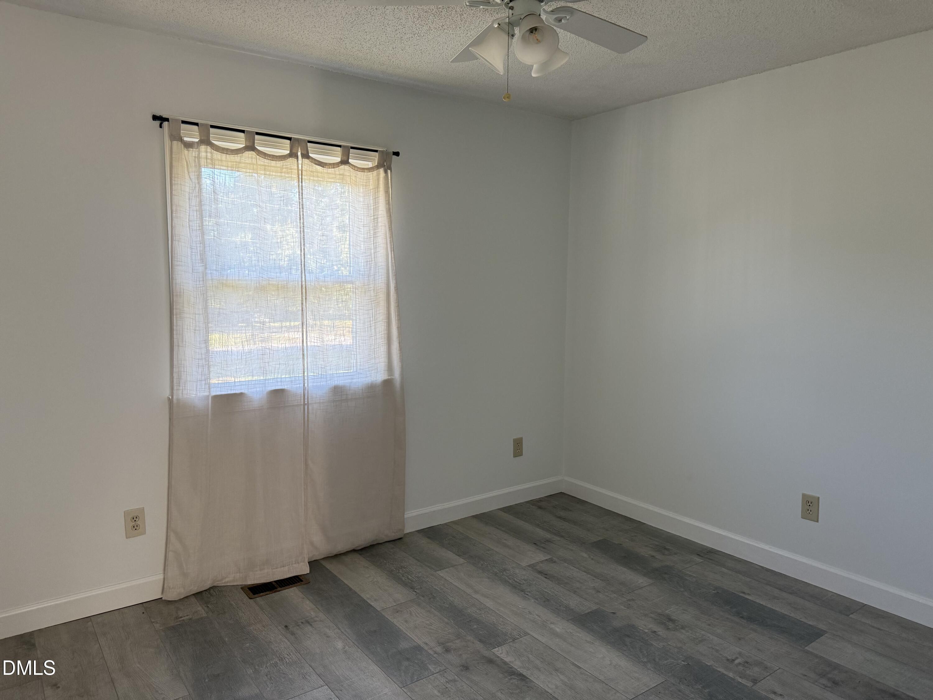 5509 Sandy Run Knightdale, NC 27545 - Photo 21 of 21 an empty room with a window