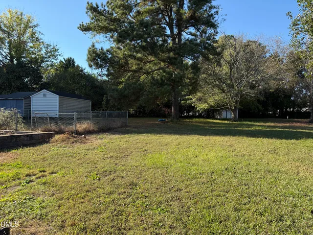 a view of a swimming pool and lounge chairs