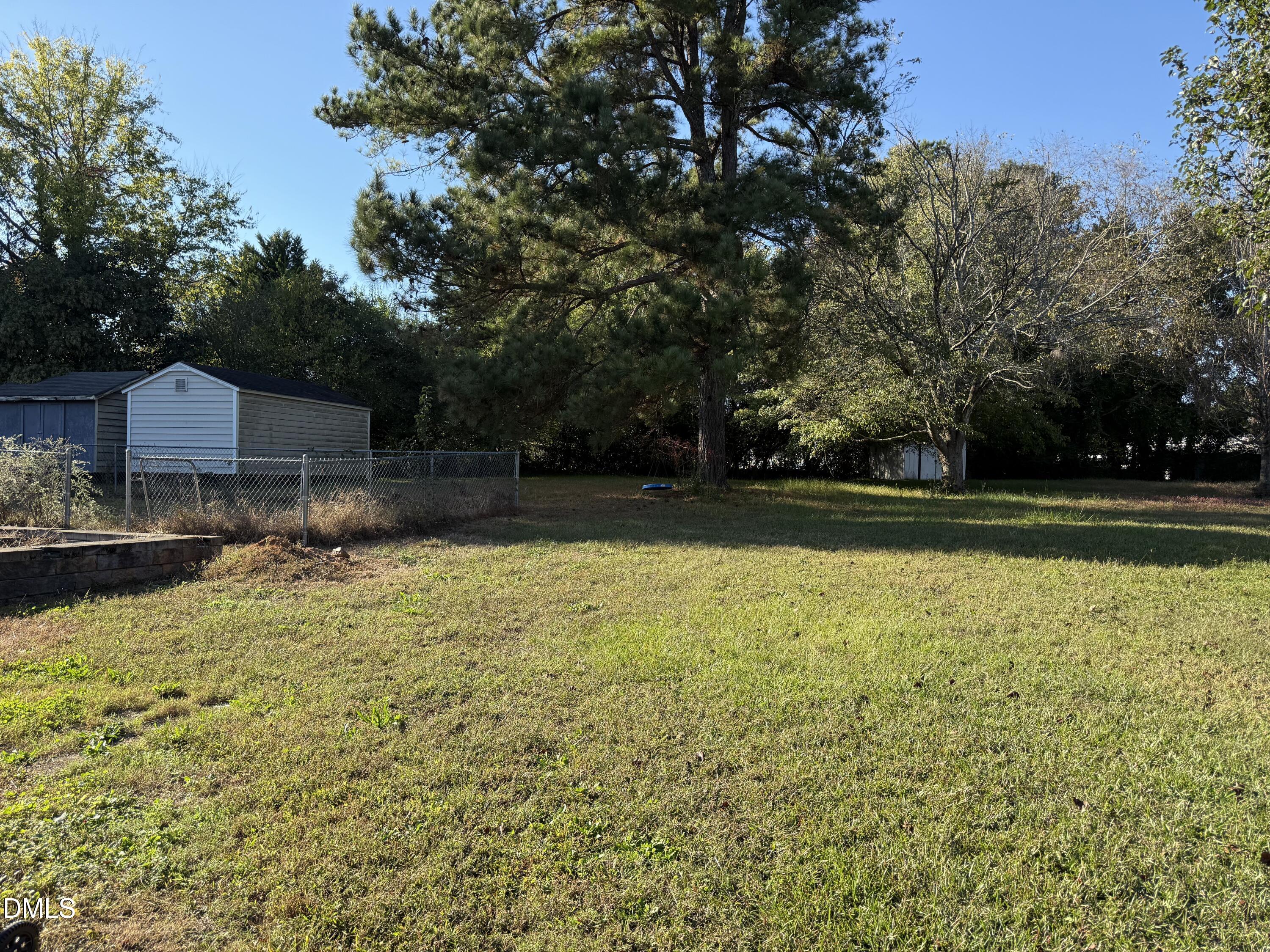 5509 Sandy Run Knightdale, NC 27545 - Photo 4 of 21 a view of a swimming pool and lounge chairs