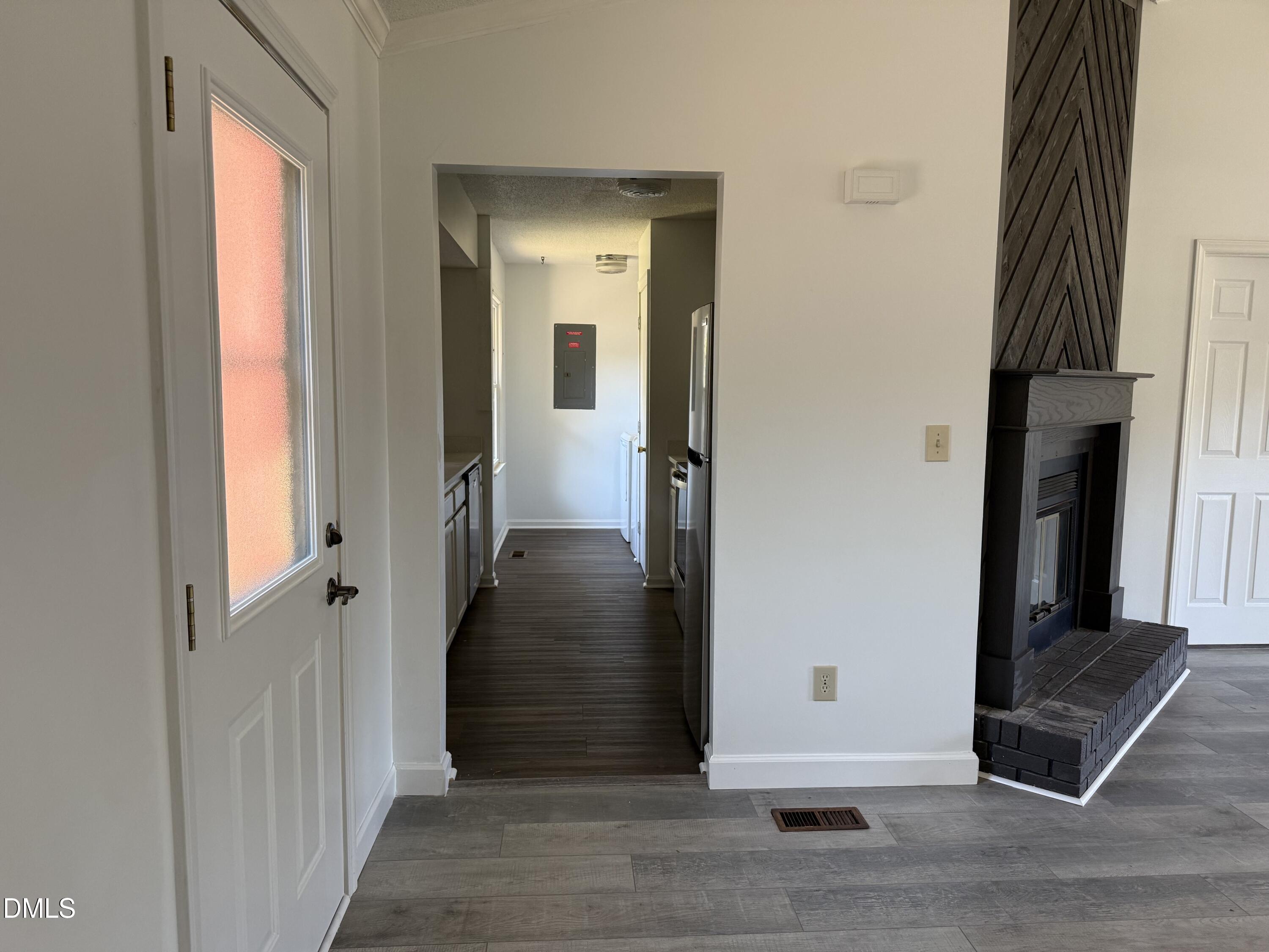 5509 Sandy Run Knightdale, NC 27545 - Photo 10 of 21 a view of a hallway with wooden floor and staircase