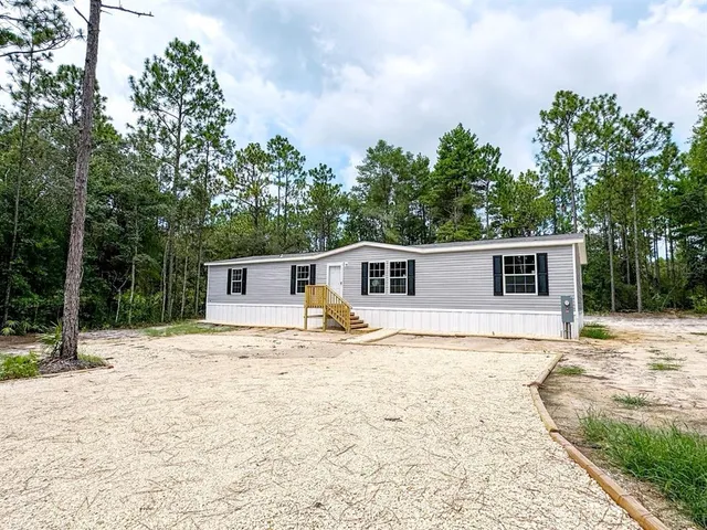 a house with trees in the background