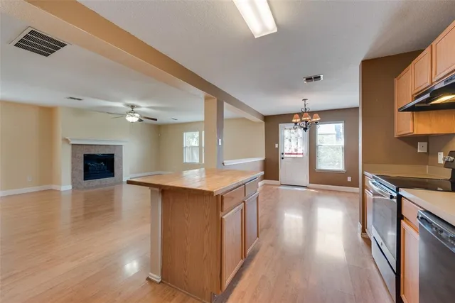 a view of a kitchen counter top space and wooden floor