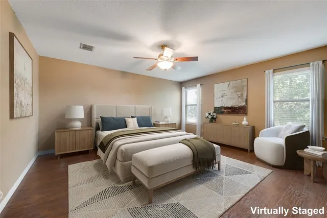 a bedroom with bed and a chandelier