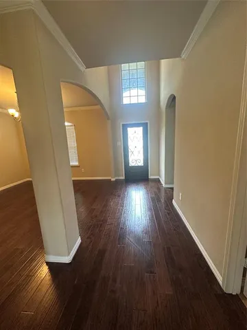 wooden floor in a hall with an entryway