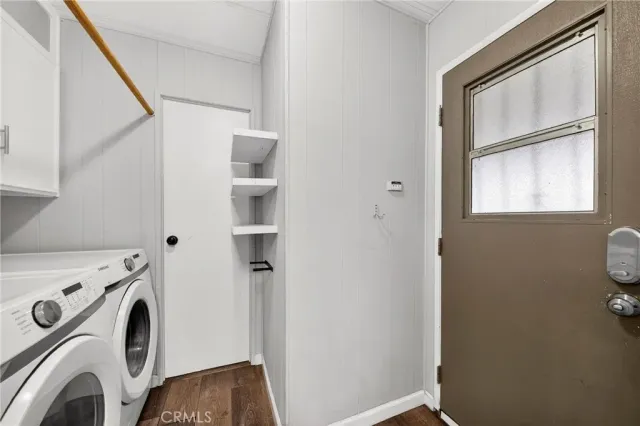 a view of storage and utility room with washer and dryer