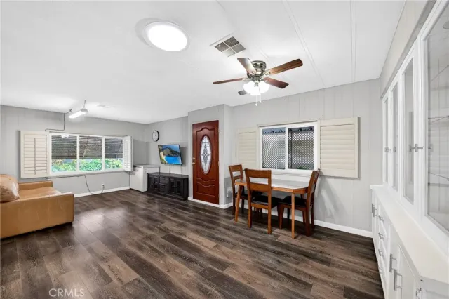 a view of a dining room with furniture window and wooden floor