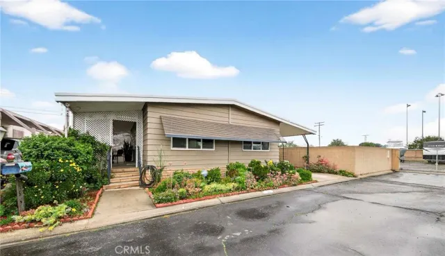 a front view of house along with street view
