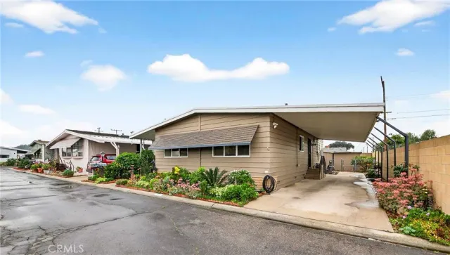 a view of a house with a backyard