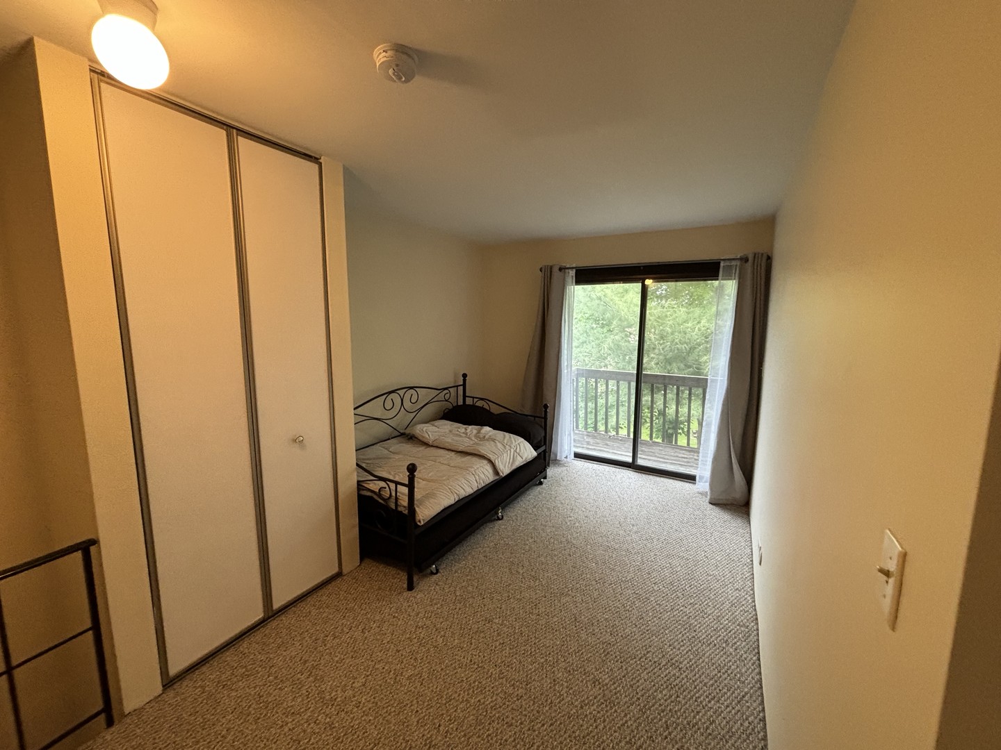 59 Vail Colony Street, Unit 3 Fox Lake, IL 60020 - Photo 11 of 24 a view of a room with a bed and a window