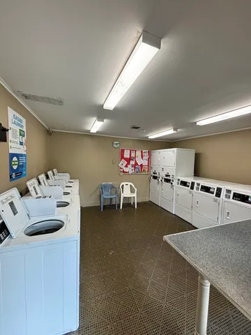 a kitchen with furniture and a table