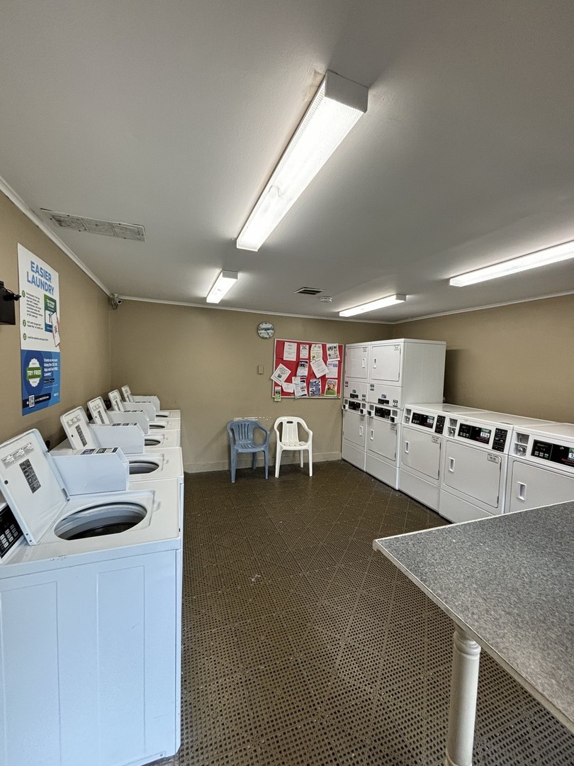 59 Vail Colony Street, Unit 3 Fox Lake, IL 60020 - Photo 20 of 24 a kitchen with furniture and a table