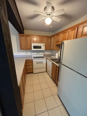 a kitchen with a refrigerator a sink and dishwasher