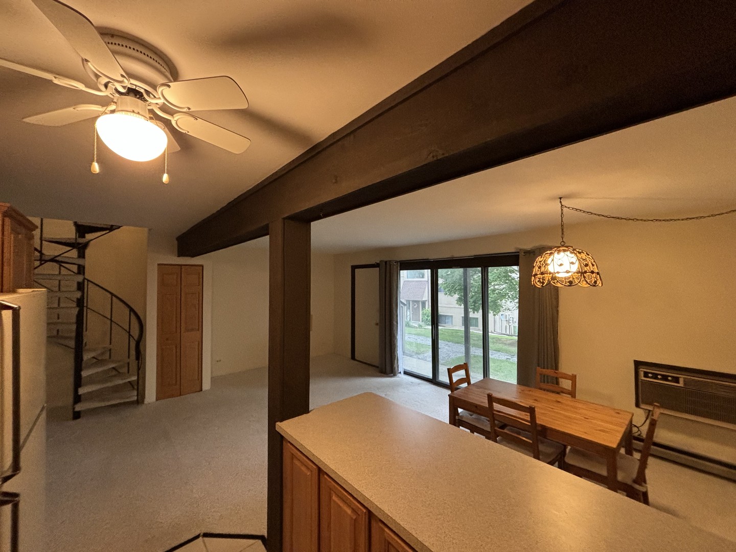 59 Vail Colony Street, Unit 3 Fox Lake, IL 60020 - Photo 6 of 24 a very nice looking room with a large window and chandelier
