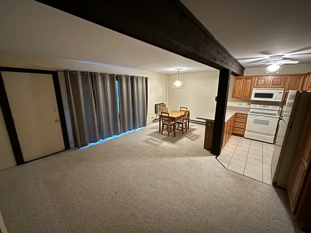 a view of a hallway with chair