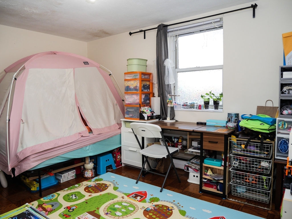 217 Kent Street, Unit 1 Brookline, MA 02446 - Photo 3 of 8 a view of a dining room with furniture and a window
