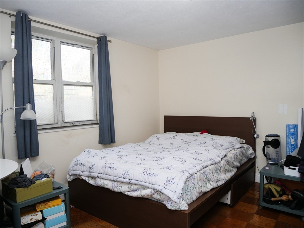 217 Kent Street, Unit 1 Brookline, MA 02446 - Photo 4 of 8 a bedroom with a bed and a window