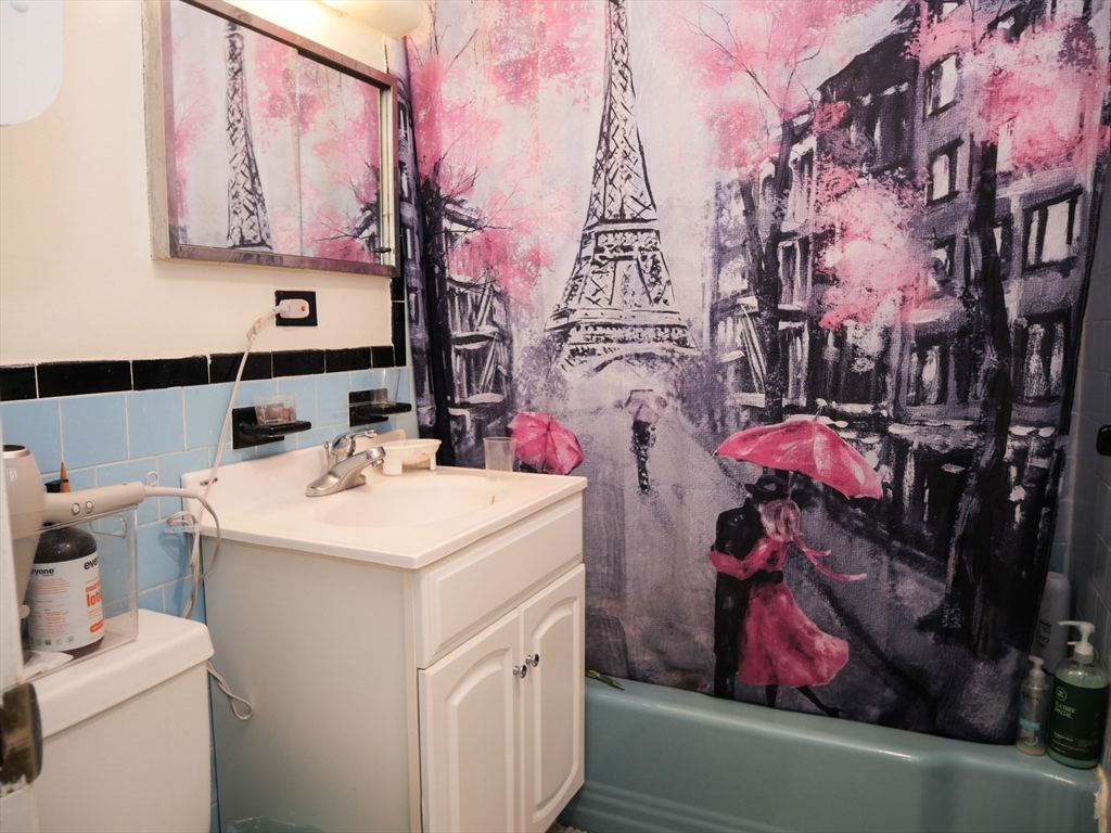217 Kent Street, Unit 1 Brookline, MA 02446 - Photo 7 of 8 a utility room with dryer and washer