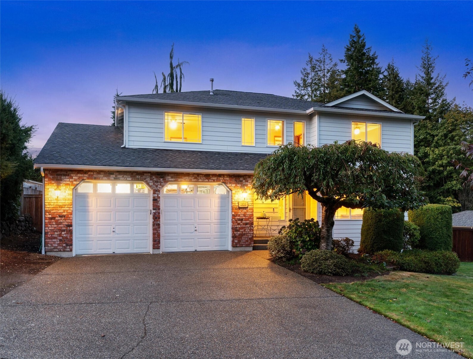 2525 113th Place Southeast Everett, WA 98208 - Photo 2 of 37 a front view of a house with a yard and garage