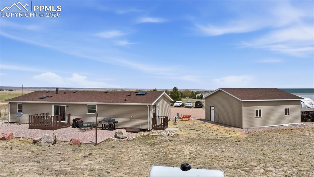 20985 McDaniels Road Calhan, CO 80808 - Photo 8 of 41 a view of a house with a yard and wooden fence
