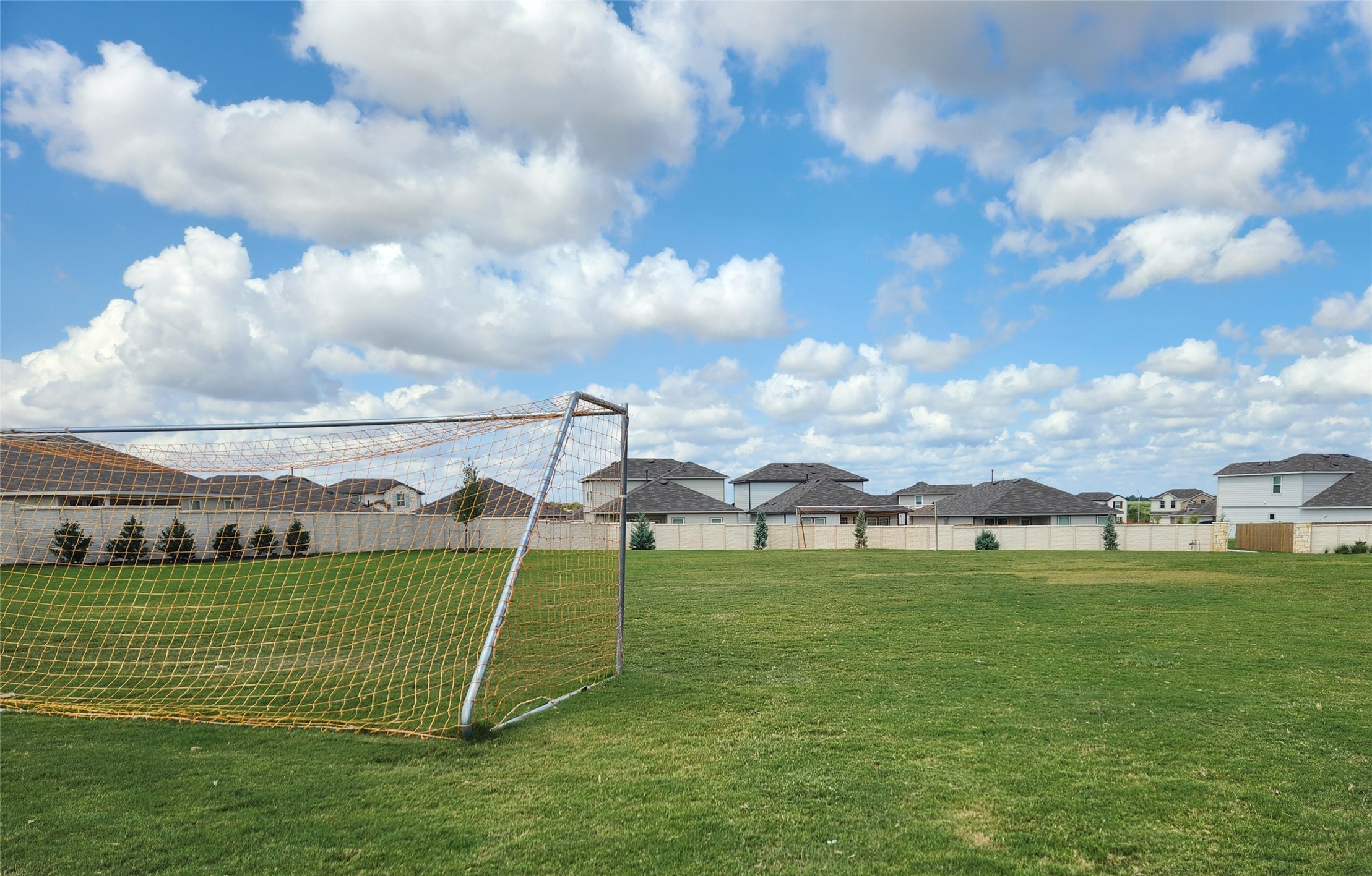 165 Santa Rosa Lane Buda, TX 78610 - Photo 18 of 21 a view of a golf course with a bench