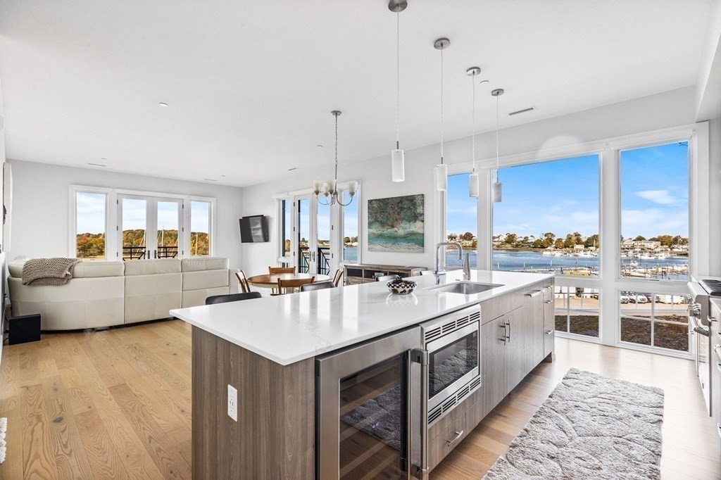 10 Shipyard Drive, Unit 312 Hingham, MA 02043 - Photo 12 of 35 a large kitchen with a lot of counter space and stainless steel appliances
