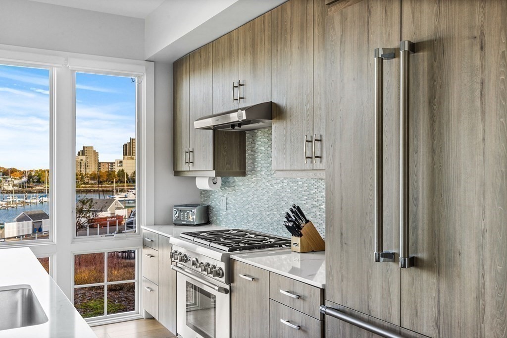 10 Shipyard Drive, Unit 312 Hingham, MA 02043 - Photo 14 of 35 a kitchen with cabinets and appliances