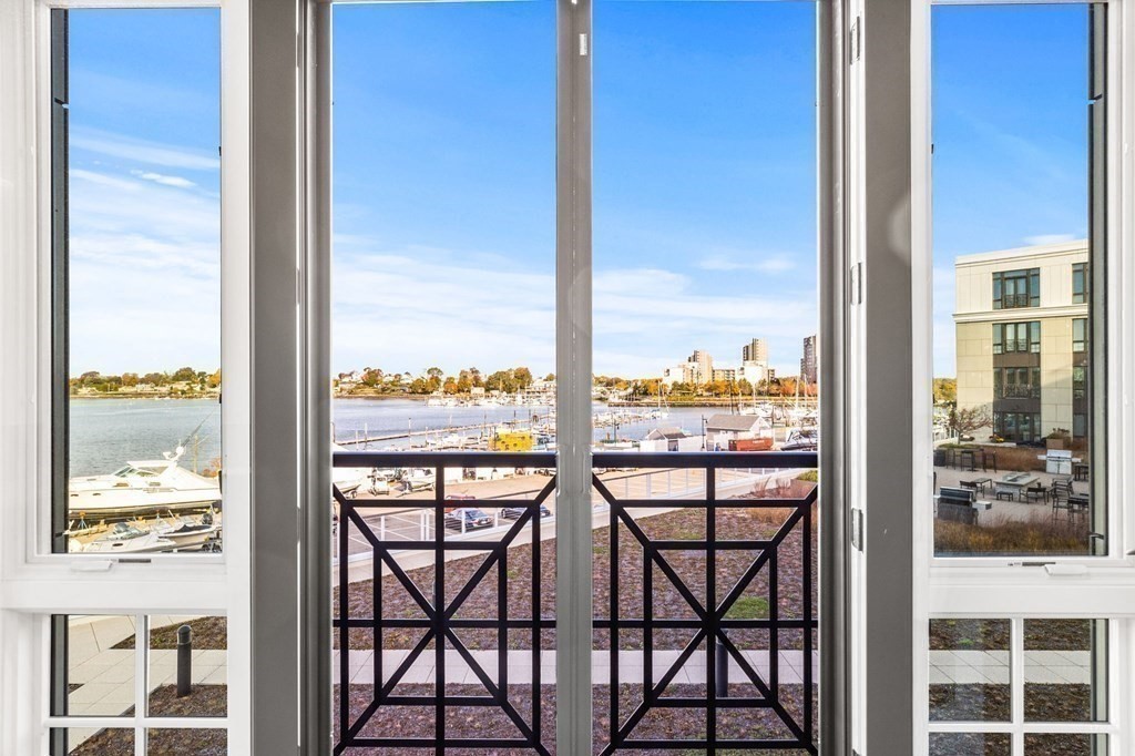 10 Shipyard Drive, Unit 312 Hingham, MA 02043 - Photo 18 of 35 a view of a balcony with table and chairs