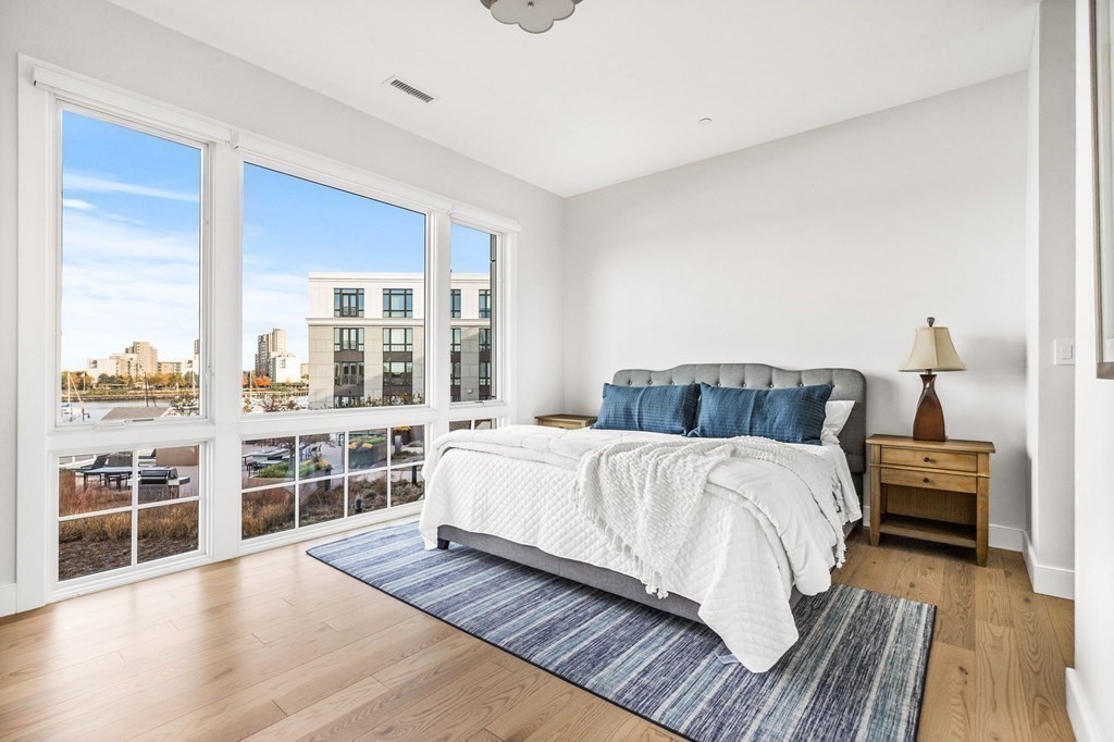 10 Shipyard Drive, Unit 312 Hingham, MA 02043 - Photo 24 of 35 a bedroom with a large bed and a large window